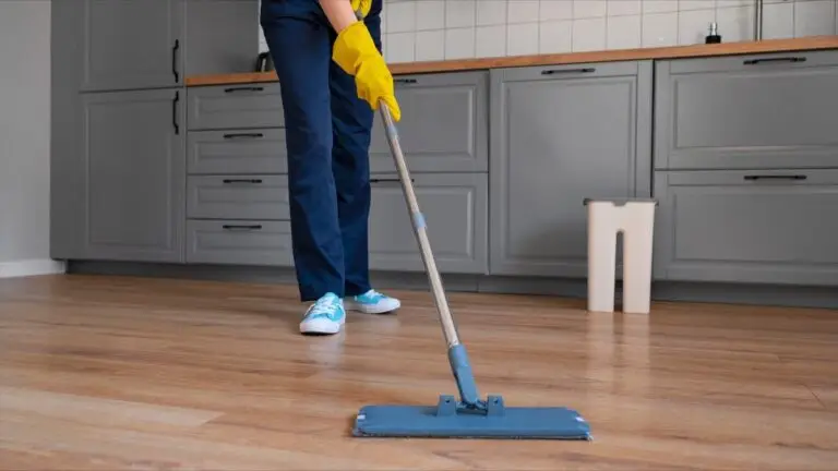 Cleaner mopping kitchen floor with flat mop