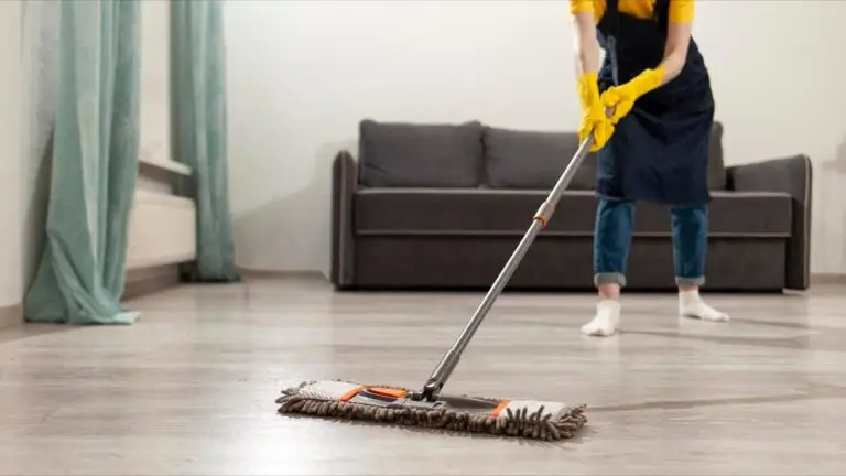 Cleaner mopping living room floor