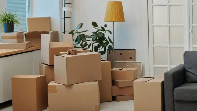 Cardboard moving boxes stacked in a living room