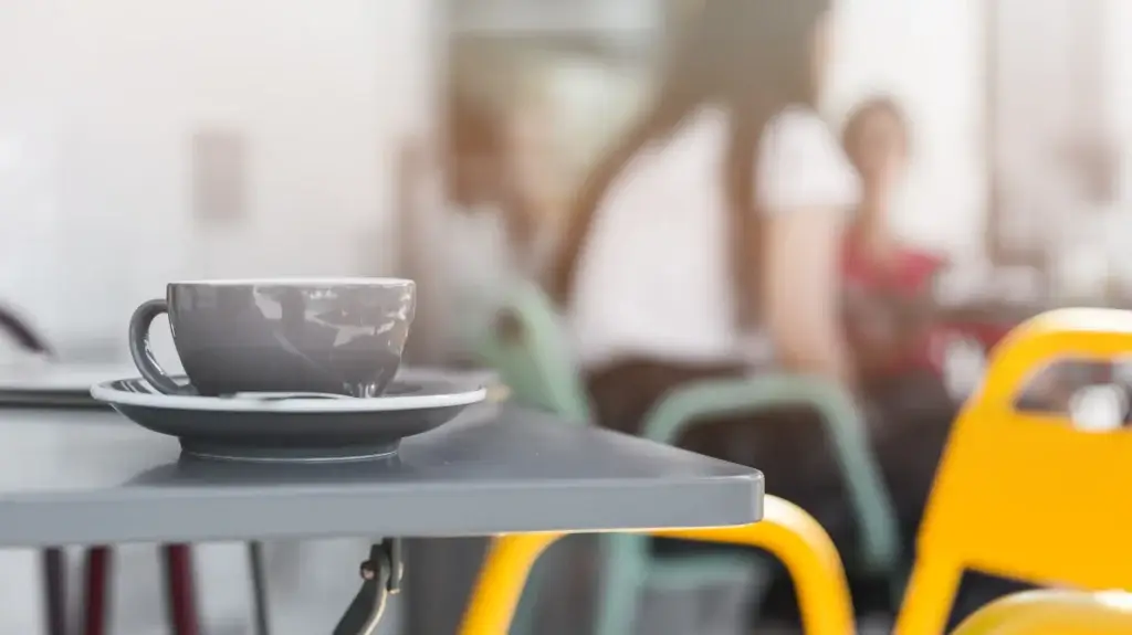 Grey coffee cup on a cafe table